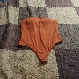 I'm selling a orange bodysuit